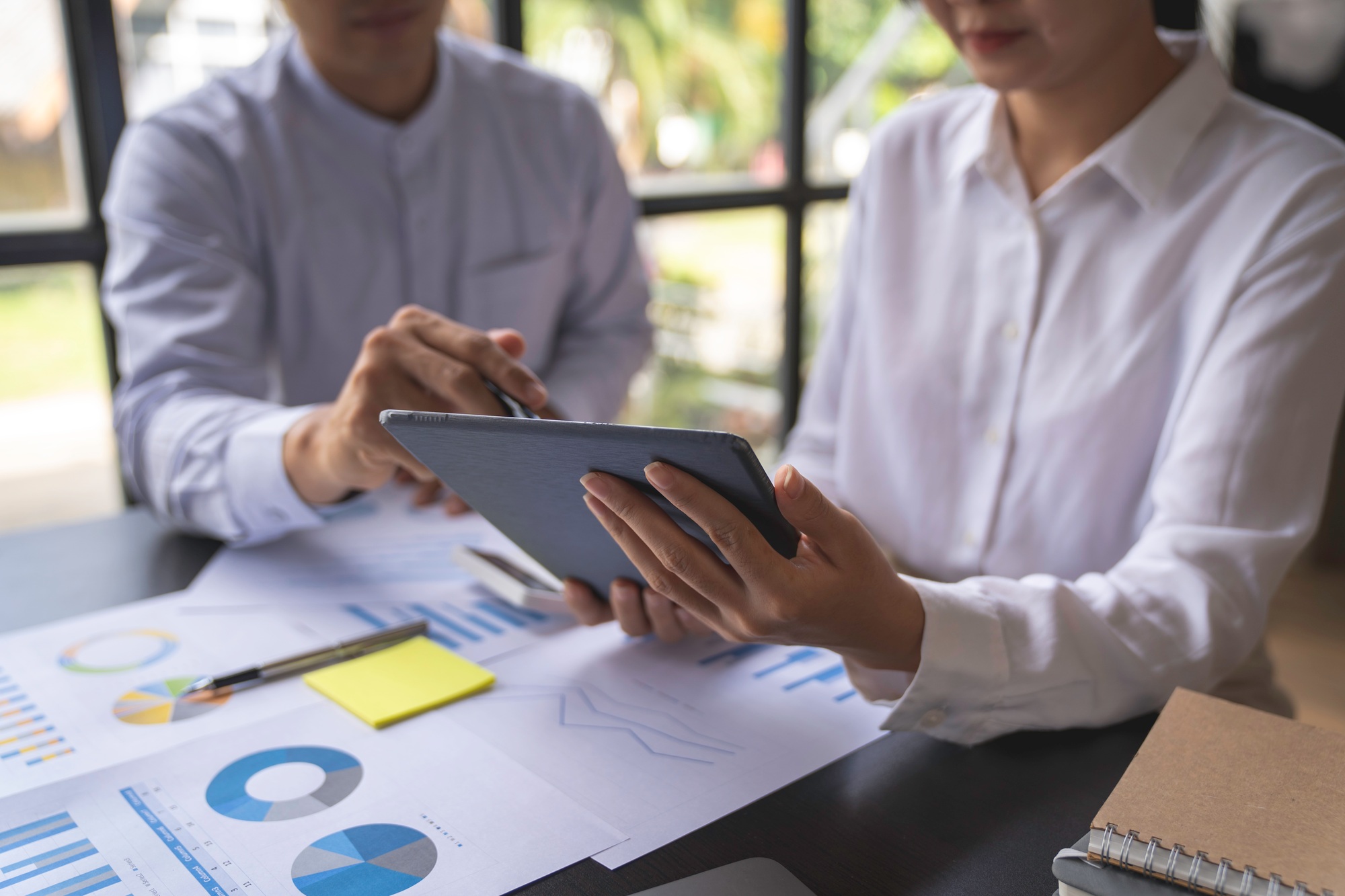 Bookkeeper diverse coworkers working together in the boardroom, brainstorming, discussing, and analy