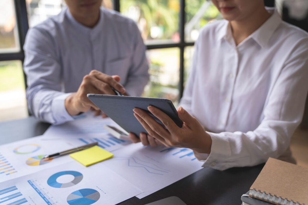 Bookkeeper diverse coworkers working together in the boardroom, brainstorming, discussing, and analy